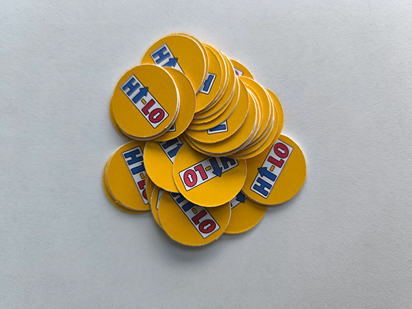 A pile of yellow HI-LO tokens